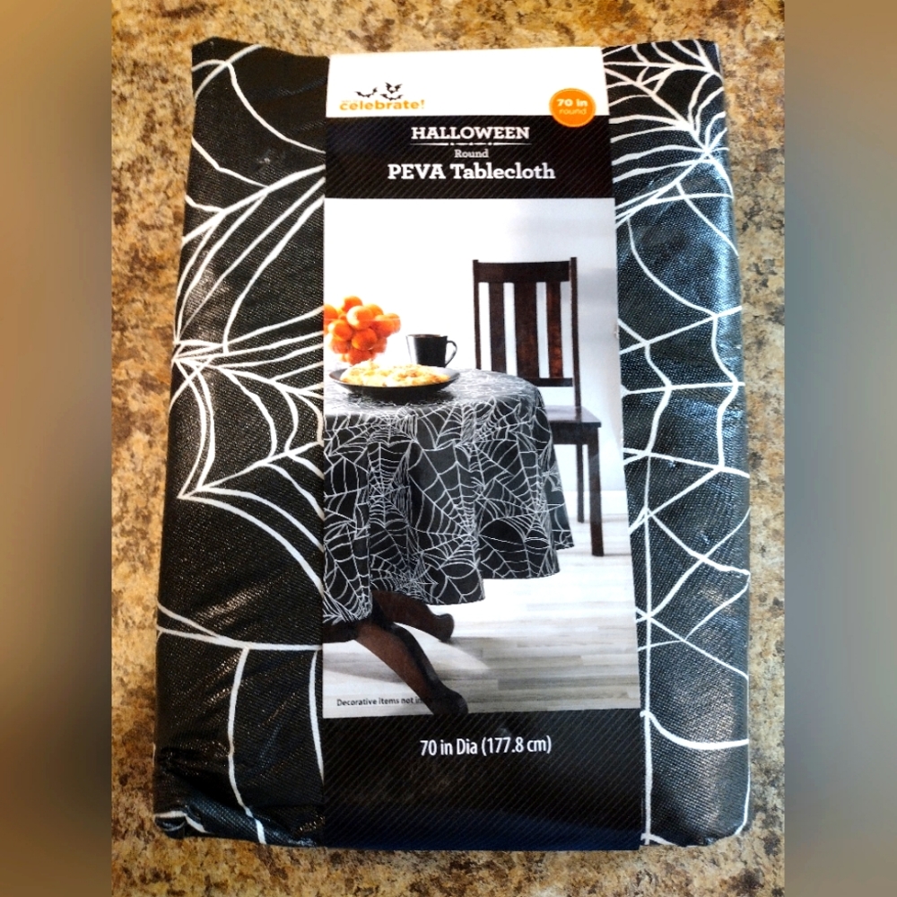 Celebrate! Spiderweb design round table cloth, 70 inches. Black and white.